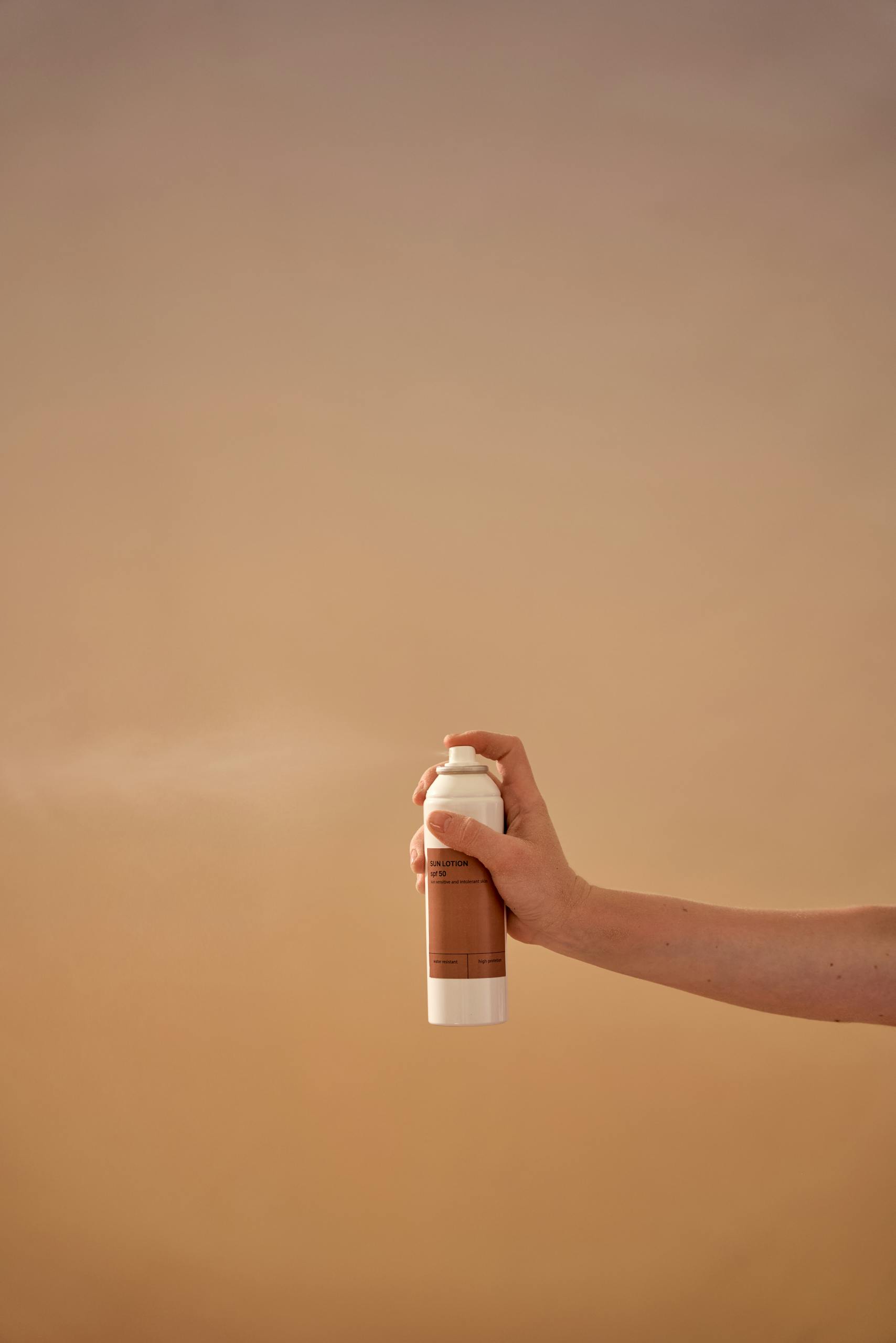 Cosmetic Brand held by a Person